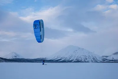 A kite above a frozen lake in winter