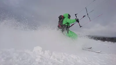 Starting out on a snowkite across a snow field