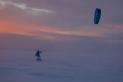 Snowkite rider at dusk in the Arctic