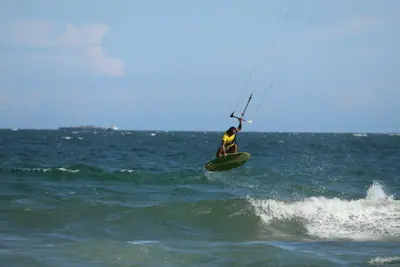 A kiter on the wave, Sandunes beach, Mui Ne