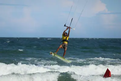 A big kite jump above the wave