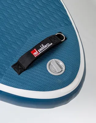 Red Paddle Co 10'8" Ride MSL Inflatable Paddle Board Package. Inflatable SUP board — in action on the water